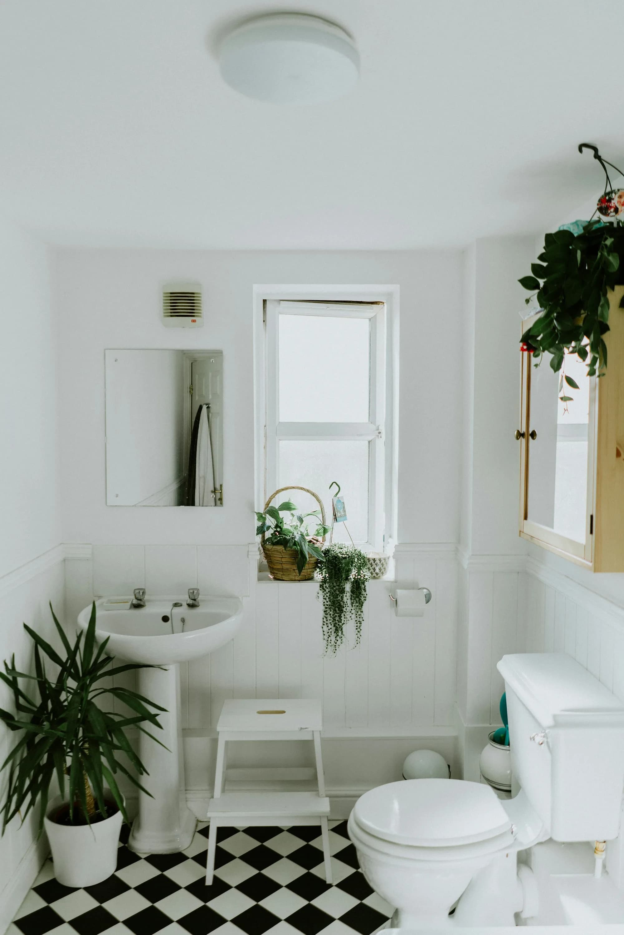 Original bathroom with small tub and single vanity