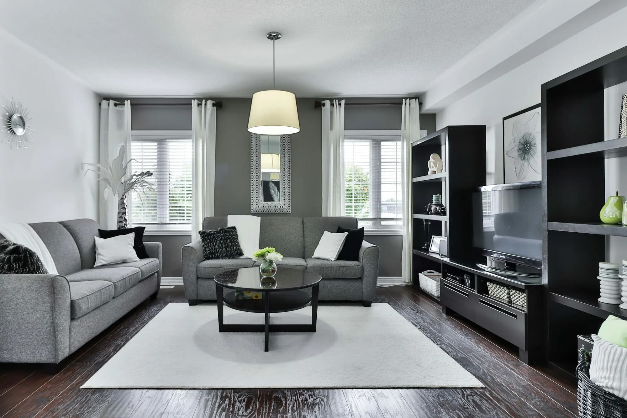 Living room with new wide-plank floors and fireplace wall